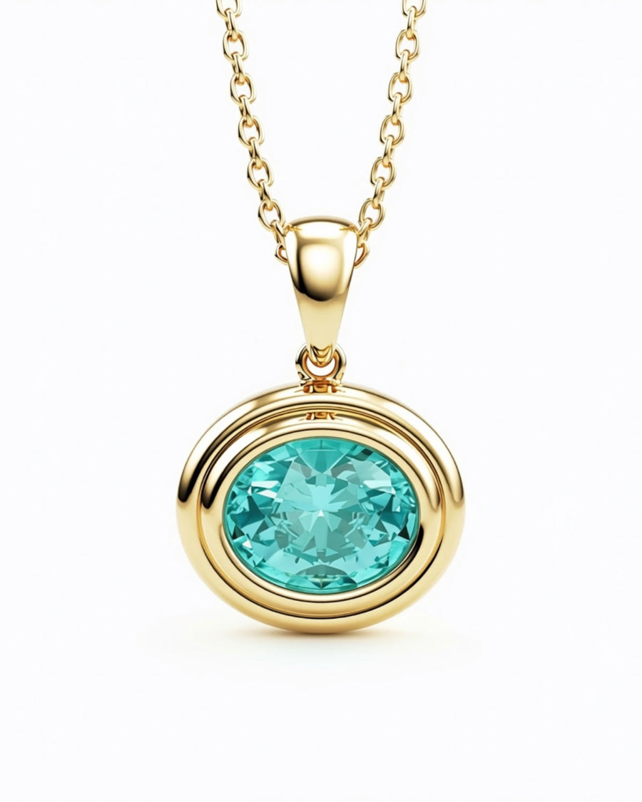 Oval aquamarine pendant bezel set in yellow gold, the March birthstone
