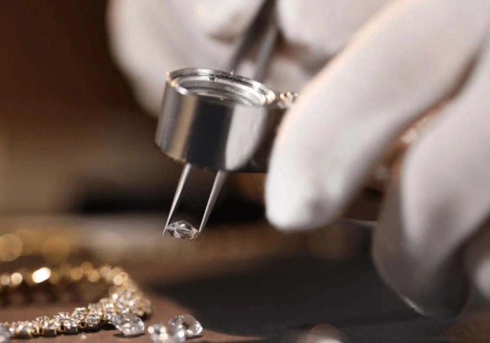 jeweller placing diamonds argent and asher