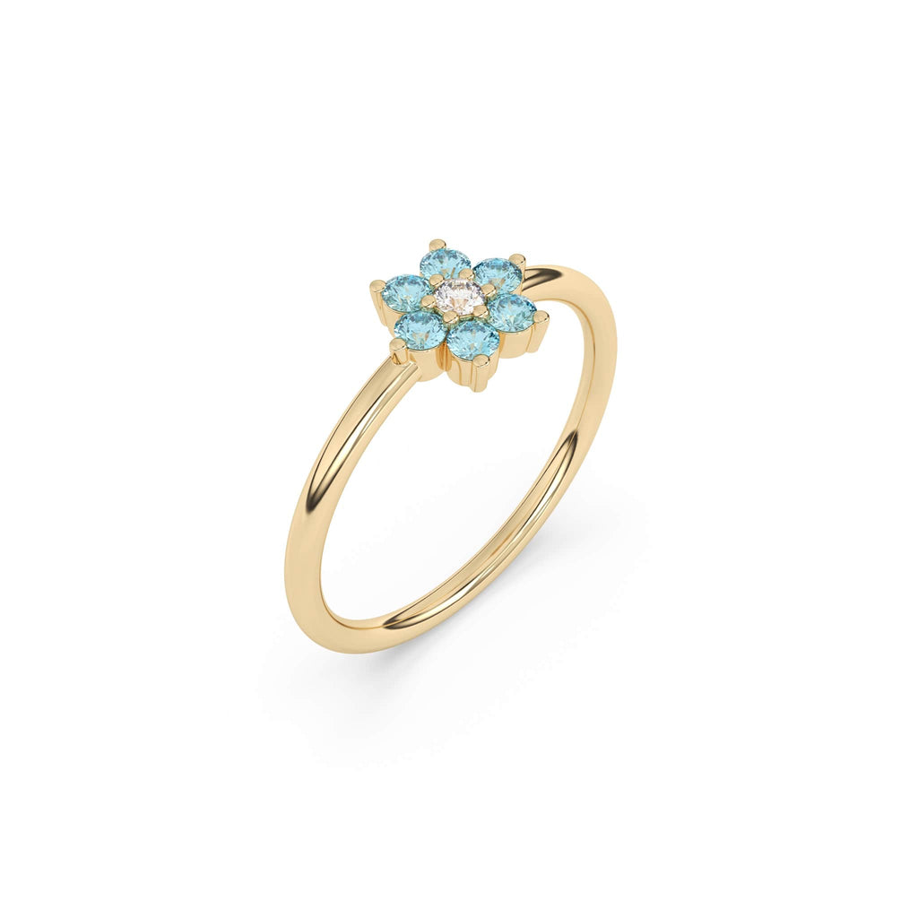 Blue Topaz flower ring in 14k yellow gold with a centre diamond stone