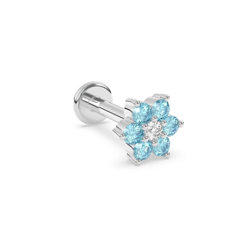 blue topaz flower earring in white gold with a diamond centre stone