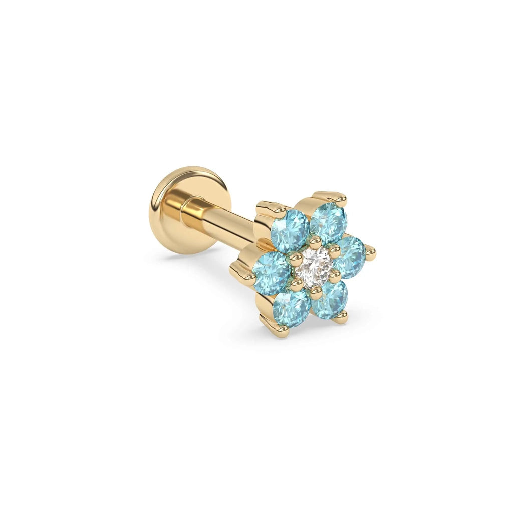 Blue topaz flower earring with a diamond centre stone in yellow gold 