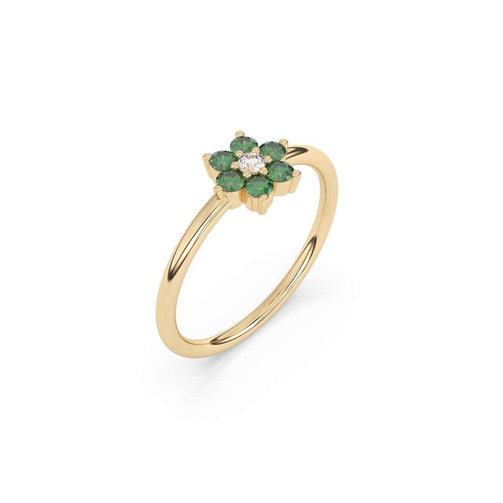 emerald flower ring in 14k yellow gold with a centre diamond stone
