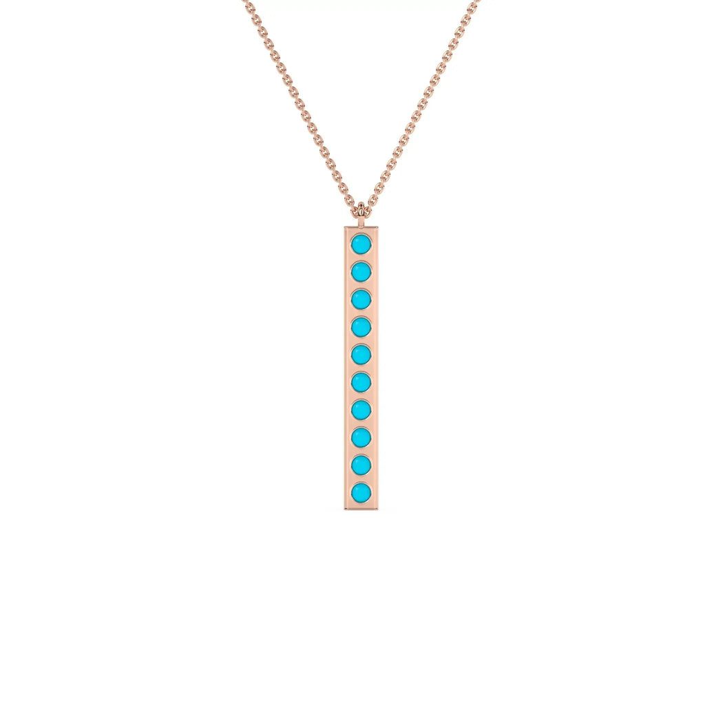 solid gold pendant handmade with turquoise beads bezel set into a 14k solid gold