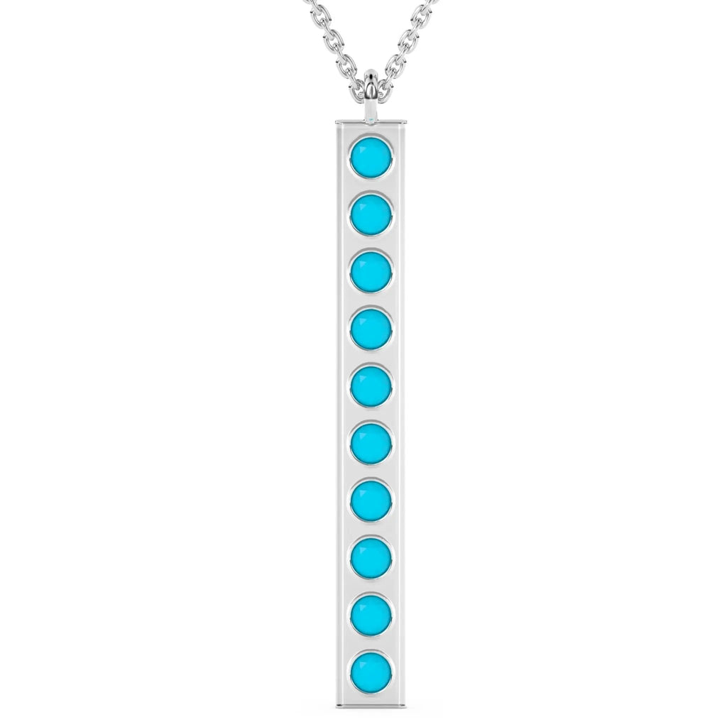solid gold pendant handmade with turquoise beads bezel set into a 14k solid gold