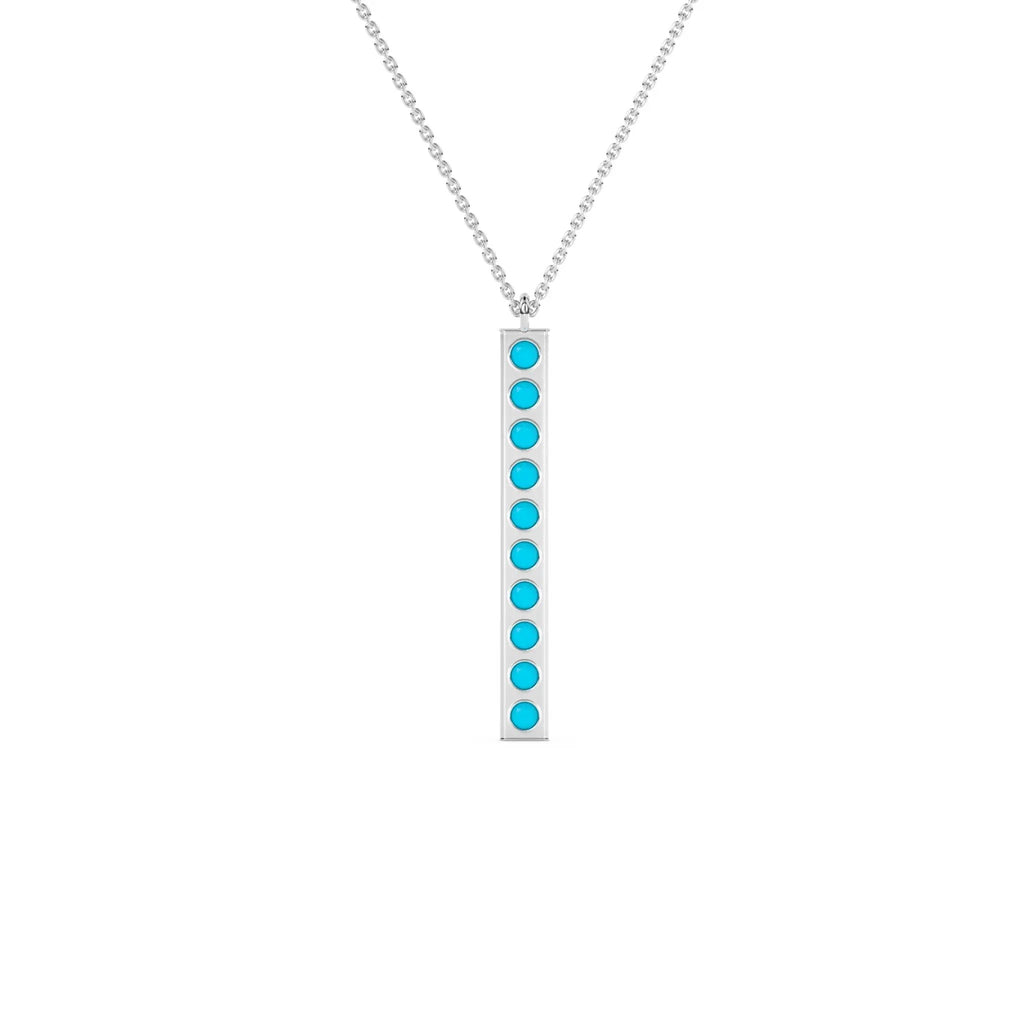 solid gold pendant handmade with turquoise beads bezel set into a 14k solid gold