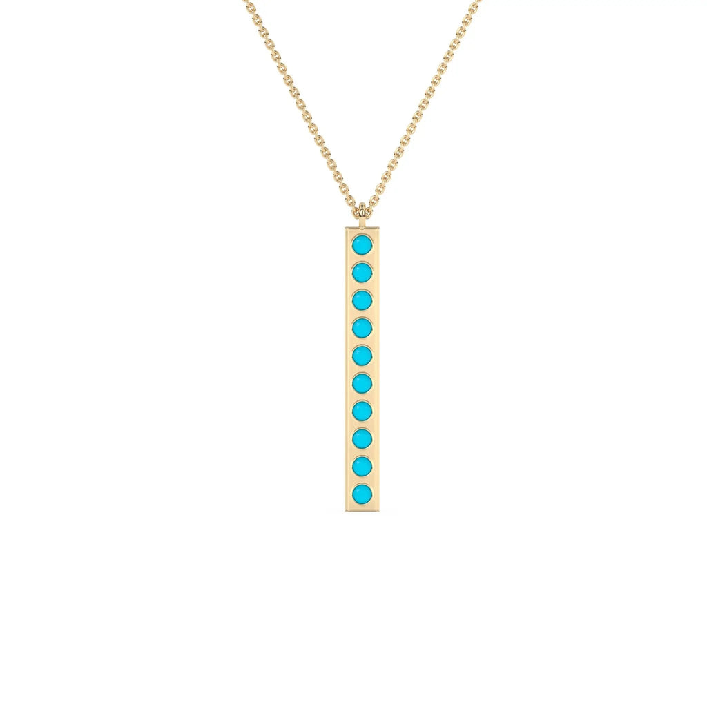 solid gold pendant handmade with turquoise beads bezel set into a 14k solid gold bar