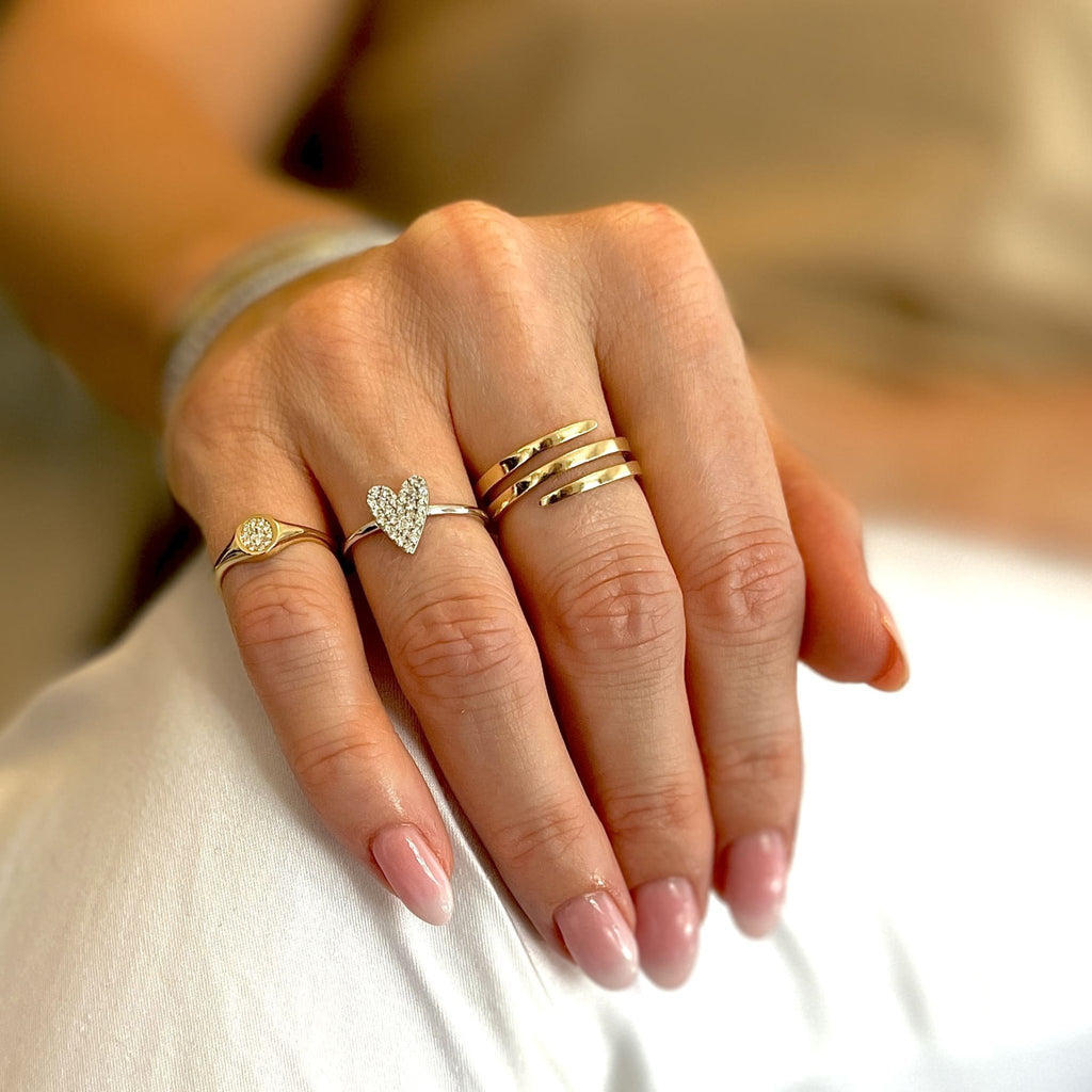 diamond oval signet ring in yellow gold styled with the diamond heart ring in white gold