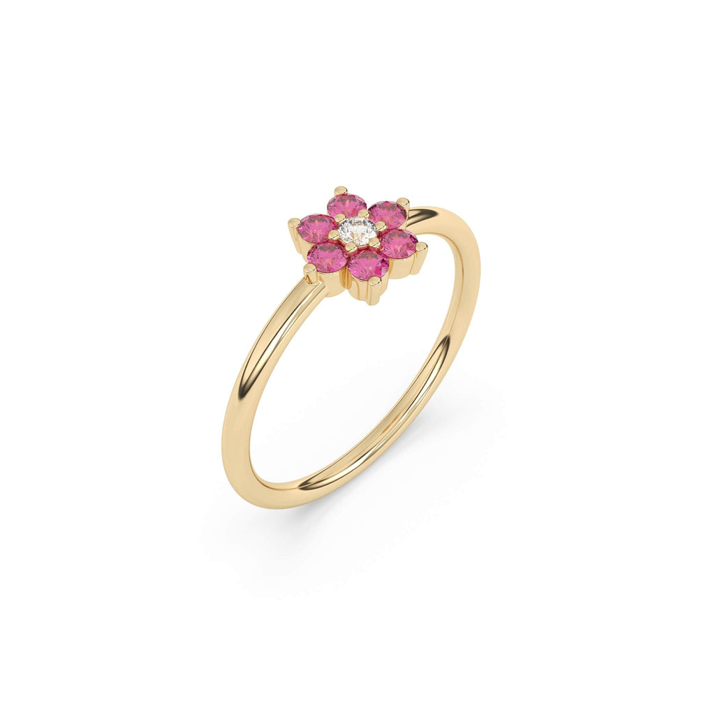 pink sapphore flower ring with a centre diamond stone made with 14k yellow gold 